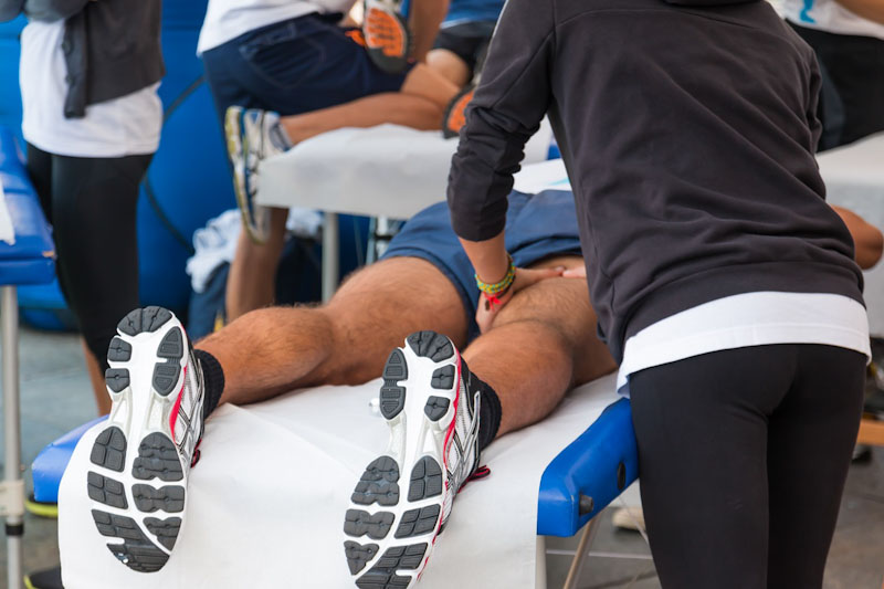 athletes relaxation massage before sport event, marathon massage